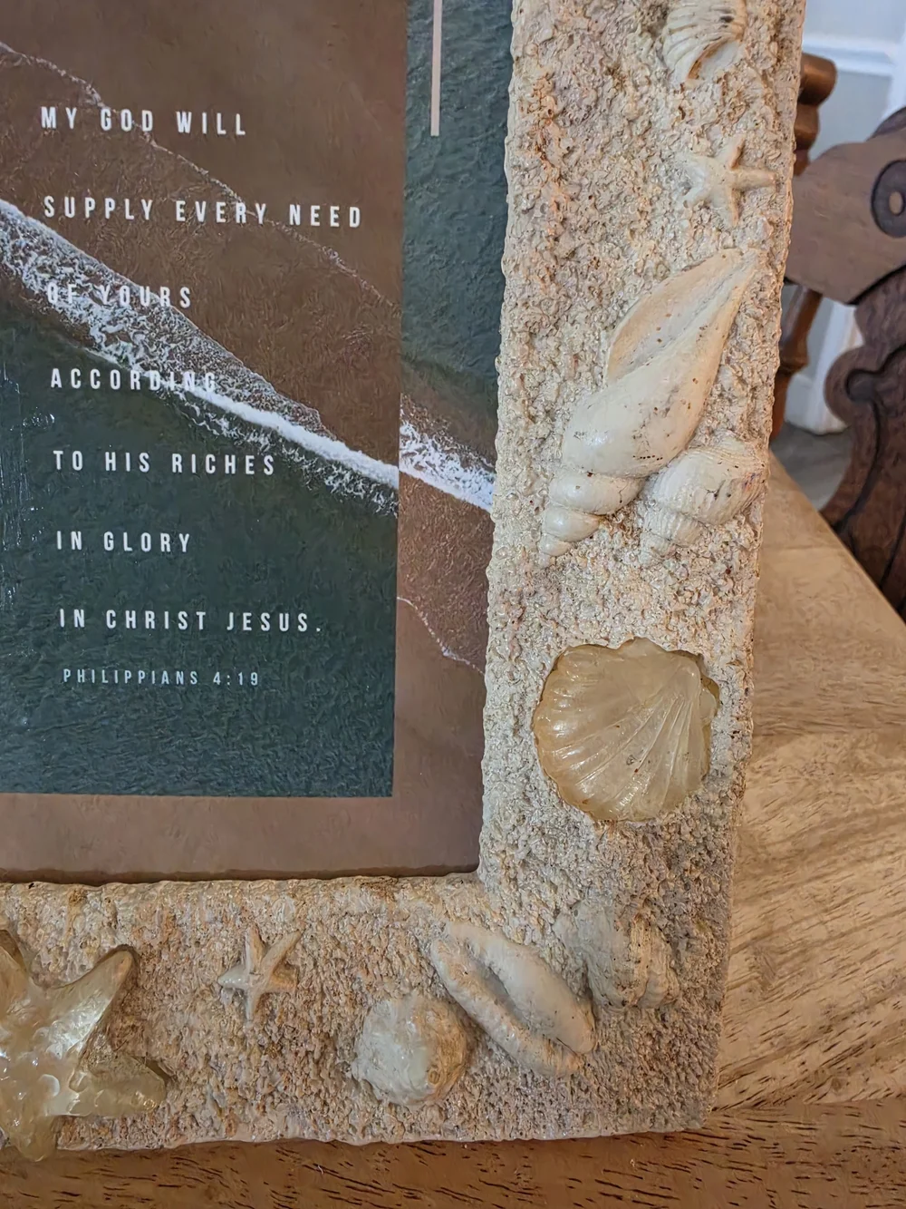 Textured beach picture frame decorated with real seashells and faux-sand finish